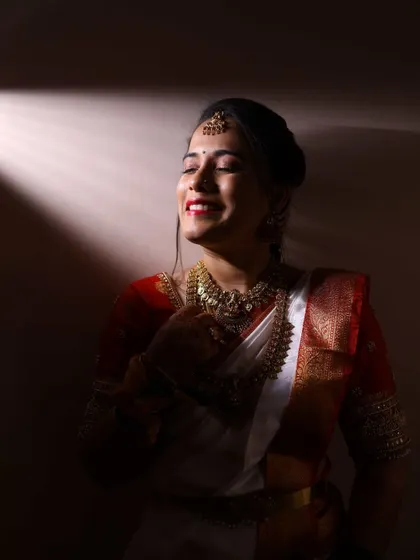 Bathed in a soft light, the bride's makeup looks absolutely flawless. I aim for a finish that enhances your natural beauty and makes you feel confident and serene.