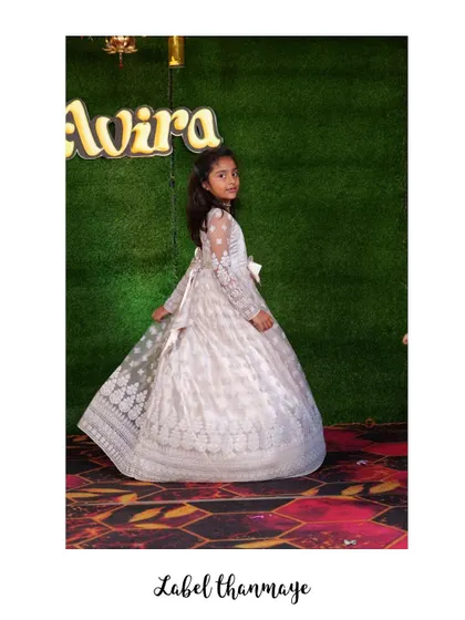 A twirl to show off the full skirt of the white lace gown.