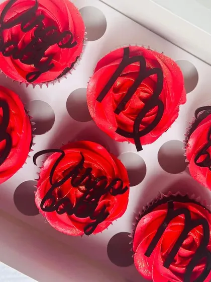 Another angle of the Virgo cupcakes, this one slightly blurred to give an artistic feel while still showing the custom toppers clearly.