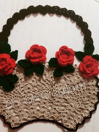 A decorative, flat-lay flower basket design, featuring a beige basket base with bright red roses. This piece can be used as a wall hanging or appliqué.