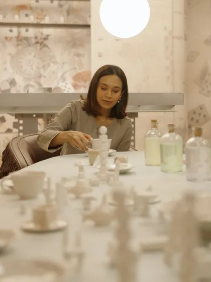 A close-up moment at the tea party table, which was adorned with a custom-made, all-white ceramic tea set. This detail shows our focus on materiality and craftsmanship, where every object contributes to the overall narrative of the experiential space.
