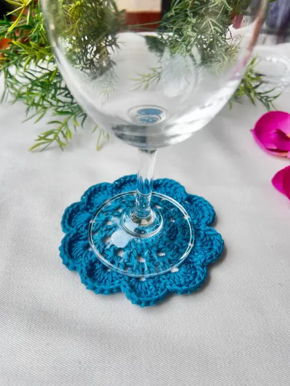This single teal mandala coaster is perfect for a wine glass, adding a pop of color and protecting your tabletop in style.