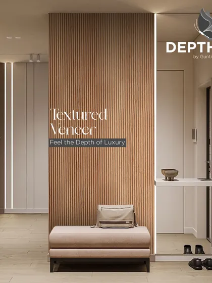 A fluted veneer panel creates a stunning feature in this entryway. Paired with integrated lighting, it's a warm and welcoming design that immediately sets a luxurious tone.