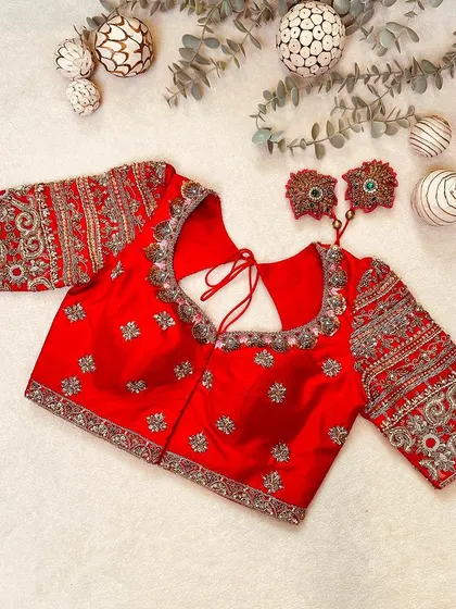 A vision in red. This Kanchi silk blouse from the 'Katha' collection is adorned with Aari and zardosi embroidery inspired by Janaki Rama.