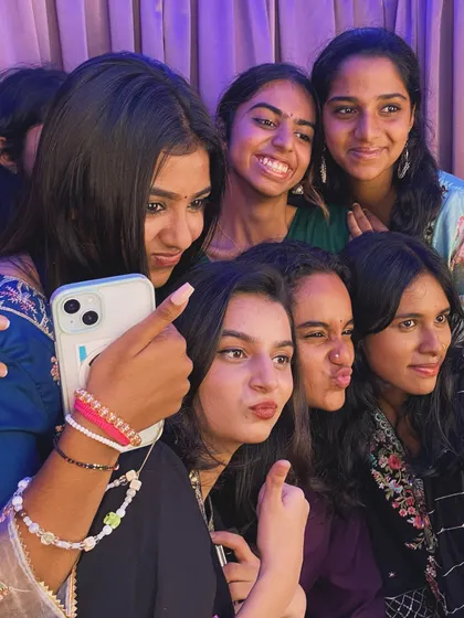 A selfie moment within a selfie moment! A group of friends capturing their fun at Mount Carmel's Ethnic Day.
