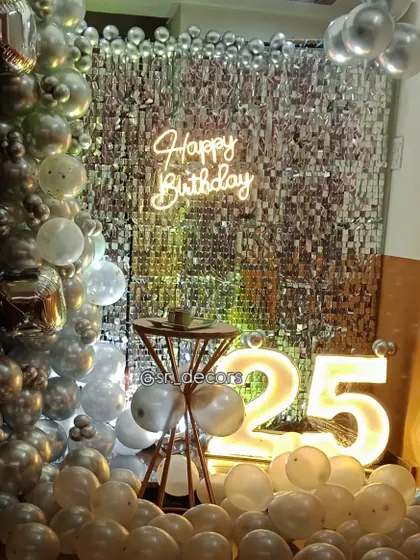 The warm lighting on this 25th birthday setup creates an inviting and celebratory atmosphere.