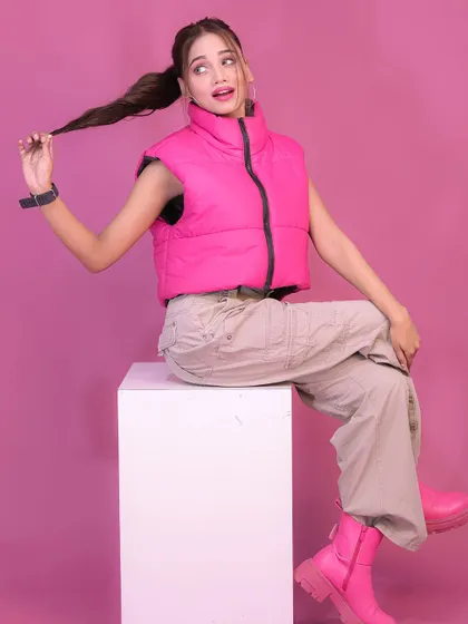 A playful pose from the pink-themed studio shoot, perfect for social media.