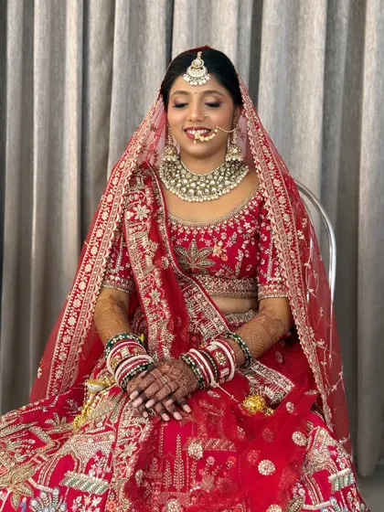 A serene shot of the bride, capturing the soft glam makeup and the beautiful details of her attire.