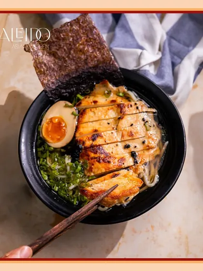 It's all about the sear. This bowl of ramen features perfectly seared chicken, a jammy egg, and rich broth. It's a complete, satisfying meal I can deliver for you or your party.