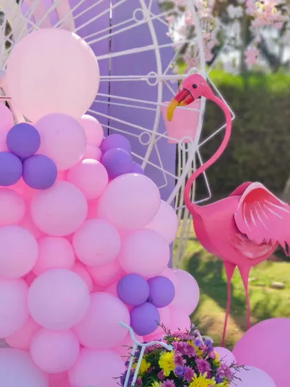 Another angle of the flamingo prop, showing how it interacts with the pink and purple balloon decor.