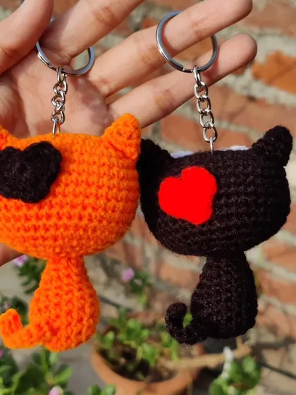 The back of my quirky kitty keychains, featuring little heart details.