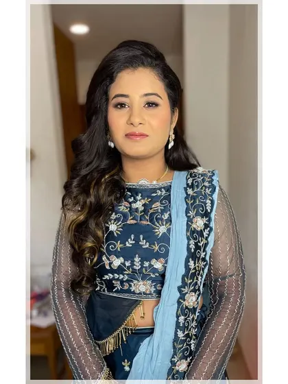 A full-face portrait of the Sangeet look. The makeup is glamorous yet soft, allowing the bride's natural beauty to shine through while ensuring she is ready for a night of celebration.