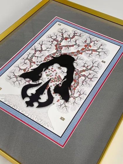 A close-up of a layered artwork featuring a 3D Trishul element. The gold metal frame and multi-layered matting add a sense of richness and dimension, highlighting the artwork's intricate composition.