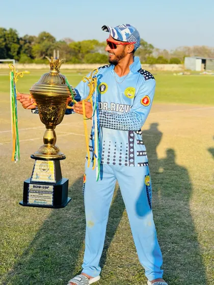 A moment of pride for one of our players, holding the Rizvi Cup trophy. We believe that individual effort is the key to team victory, and we celebrate every player's contribution.