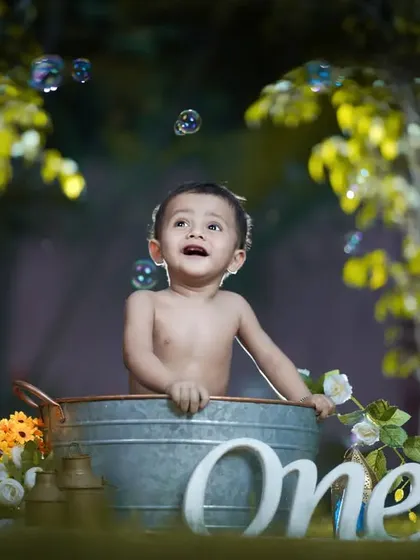 The pure, unfiltered joy of a first birthday. My post-cake smash tub-bath sessions are a favorite, turning messy fun into sparkling, happy memories.