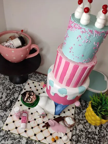 A cake that captures the chaotic life of a baker! This gravity-defying, topsy-turvy cake was made for a bakery brand, featuring a caricature of me crushed underneath. All the little baking ingredients scattered around are also completely edible.