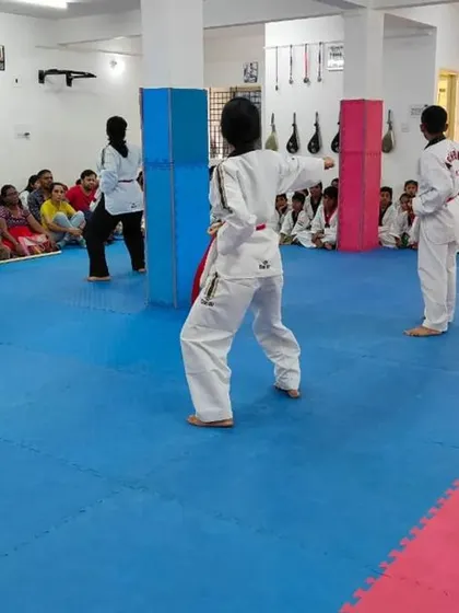 A student demonstrates a form during the belt exam.
