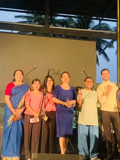 A group photo of my talented team and students on stage. We are a community of music lovers, and our concerts are a testament to our shared passion.