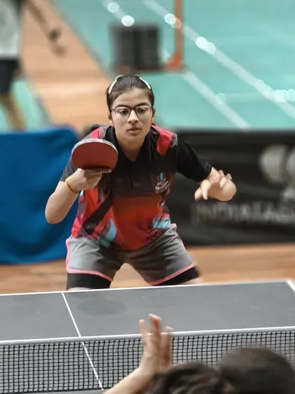One of our female players mid-rally, showcasing the high level of competition at our WTT Day Special tournament.