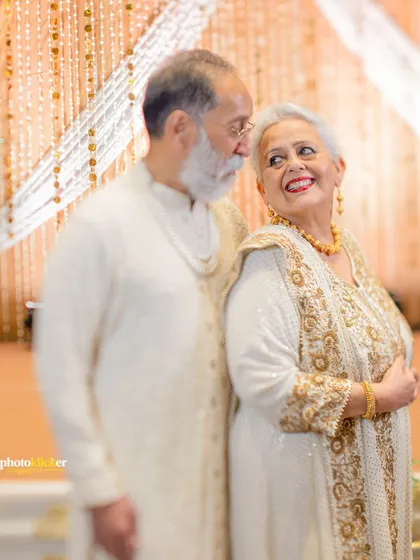 A classic, elegant portrait of the couple on their golden anniversary. Their expressions of love and companionship are truly timeless.