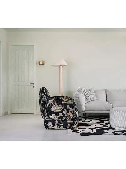 The laid-back family lounge, with its mix of comfortable seating and unique patterns, is a perfect space for joy, laughter, and good times.