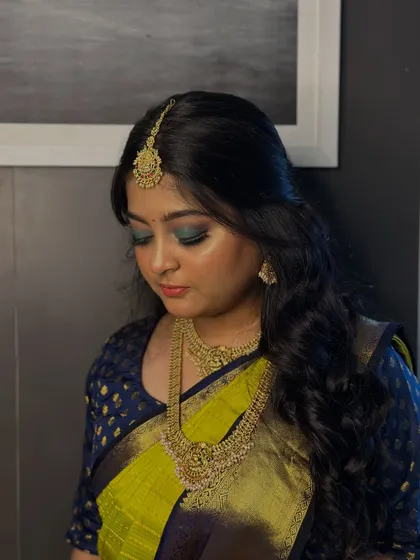 A close-up of the teal and blue smokey eye, demonstrating the advanced blending techniques our students learn in the makeup course.