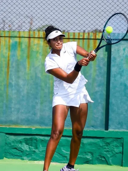 In action during the final of the ITF W25 Solapur. These photos show different aspects of my game under pressure, from hitting a running forehand to maintaining balance on a two-handed backhand.