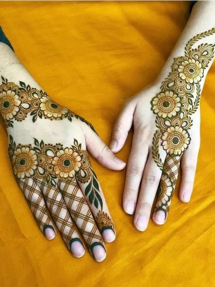 Our skills go beyond traditional designs. Here is an example of a modern floral mehndi with a beautiful jaal (net) pattern, showcasing clean lines and a balanced composition perfect for any celebration.