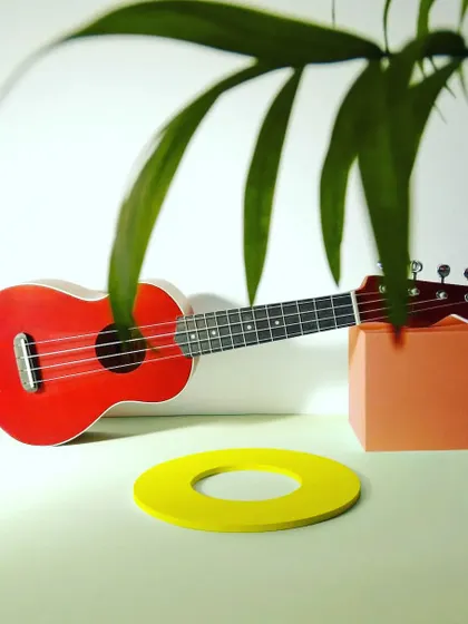 Don't just dream, do. This vibrant red ukulele is a reminder to wake up, live, and put your vision into reality.