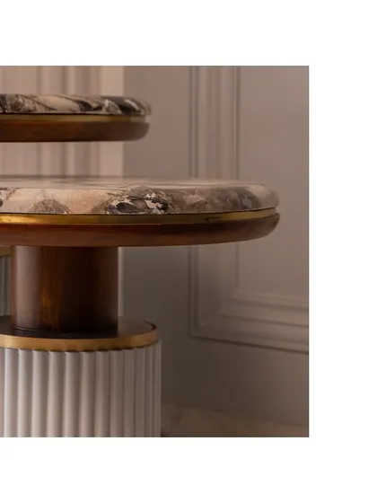 Another angle of the side tables, highlighting the contrast between the warm wood and the cool marble.