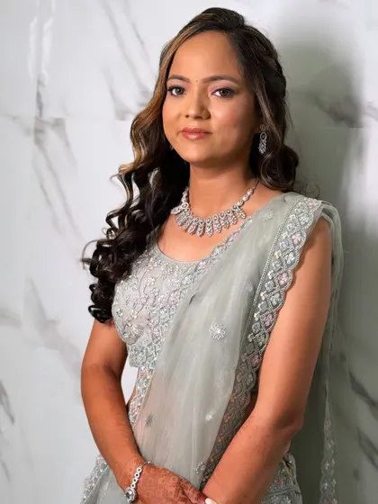 A beautiful portrait of the bride-to-be. Her highlighted hair adds dimension to her curly hairstyle.