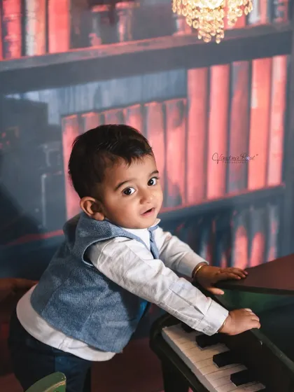 A gallery of our popular school and library theme. These images show the versatility of the brick wall backdrop, mini school desk, globe, and book props for creating a variety of scholarly and classic portraits.