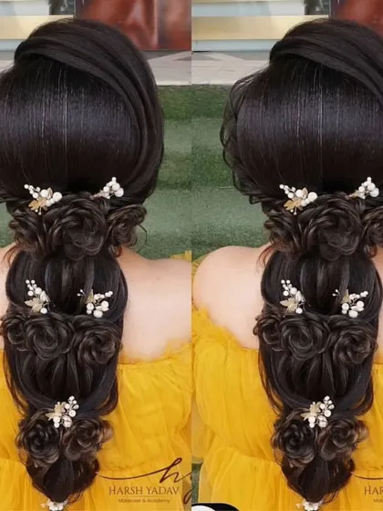 A beautiful open hairstyle with cascading roses made from hair. This is a creative and romantic look, perfect for an engagement or pre-wedding shoot.