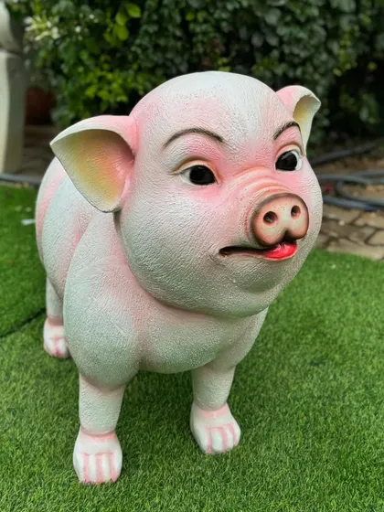 This charming pig prop adds a fun and friendly touch to any farm-themed party setup.