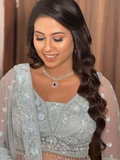 An eyes-closed shot showing the soft, neutral eyeshadow and the radiant finish of the skin. A perfect example of understated elegance.
