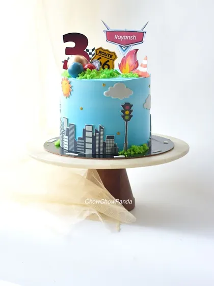 Another angle of the transport theme cake, capturing all the fun details.