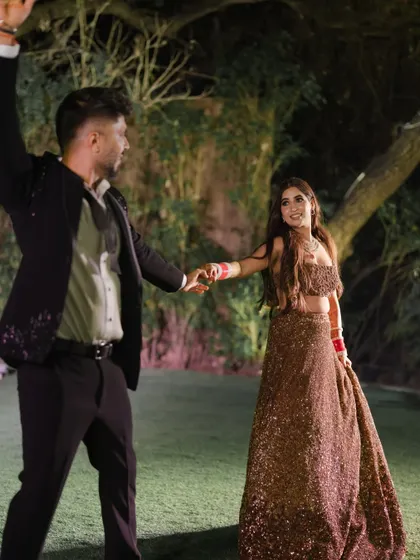 A couple sharing a dance on the lawn, a moment of pure happiness during their reception.