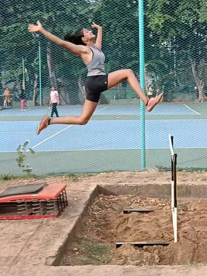 An athlete captured mid-flight during a long jump practice. We focus on perfecting the launch, flight, and landing phases to maximize distance.