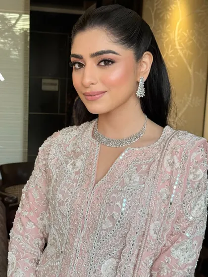 A close-up of Shubhangi's radiant Roka look. The focus is on fresh skin, rosy cheeks, and softly defined eyes for a look that is both youthful and elegant.