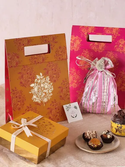 Our Festive Yellow Gift Bag is another bright and cheerful option for Diwali, containing mini cookies, fudge brownies, and sugar-free mithai.