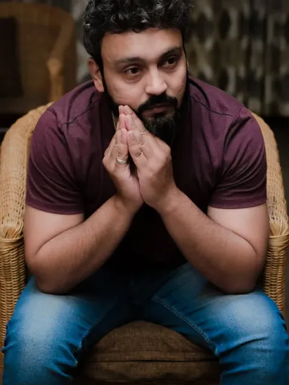Another candid self-portrait, capturing a moment of deep thought.