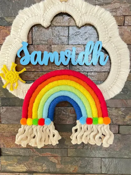 A classic rainbow dreamcatcher for 'Samarth'. The bright colors and personalized name make this a cheerful and unique piece of decor for a child's room.