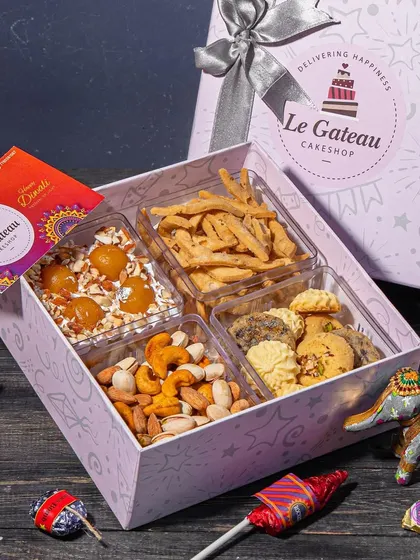 Our Diwali Wholesome Hamper features a delicious Gulab Jamun cake tub. It's a modern take on a classic dessert, with soft cake and chunks of gulab jamun in a creamy base.