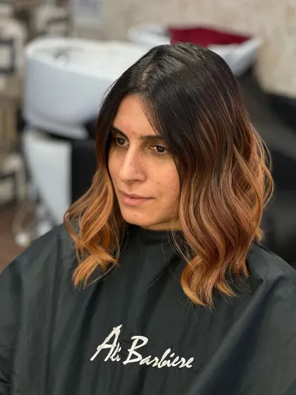 A portrait of the client, her copper hair looking vibrant and stylish.