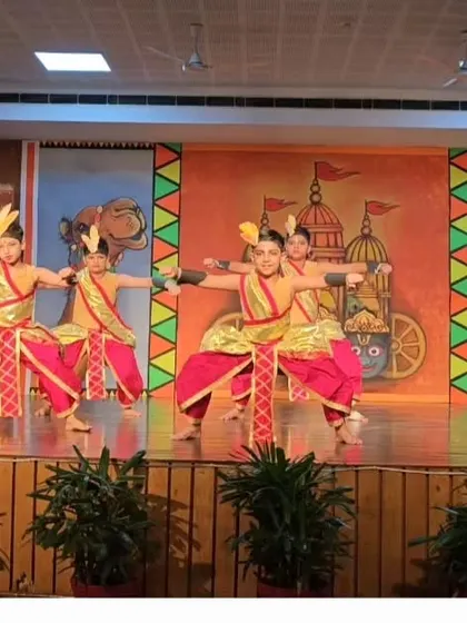 The young dancers in a frontal pose, demonstrating the confidence and discipline instilled through classical dance training.