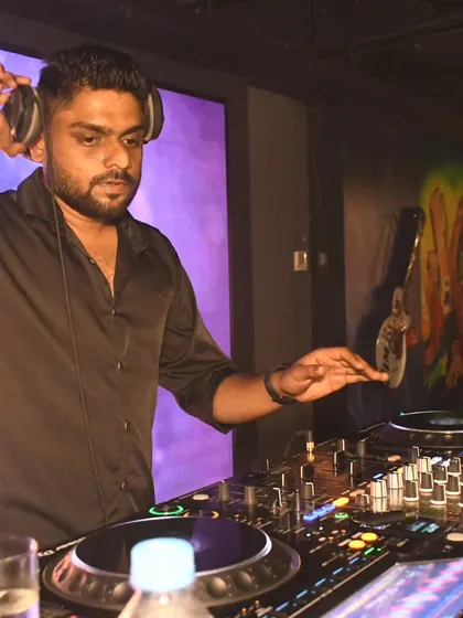 Cueing up the next track during a Friday night gig at Ludo Kitchen and Lounge. Even in a more intimate lounge setting, the energy is always high.