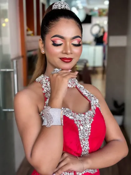 A high-fashion look with dramatic winged eyeliner and a bold red lip. This is a classic combination that you will learn to perfect.