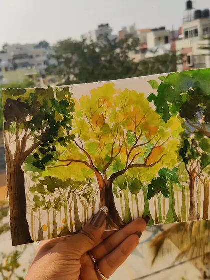 A landscape painting of trees against a city backdrop. Even though I love florals, I also enjoy the challenge of capturing the different greens of foliage.
