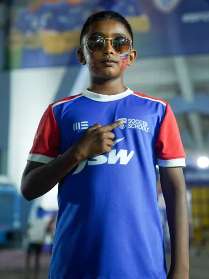 Cool shades and face paint complete the matchday look for this stylish young supporter.