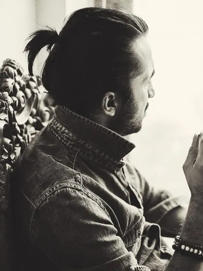 A thoughtful, candid moment captured in black and white. This is me in a quieter, more reflective mood.